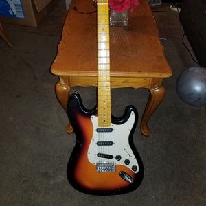 Fender speaker and a crybaby and a spectrum guitar